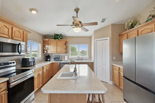 a bedroom with a bed and a flat tv screen