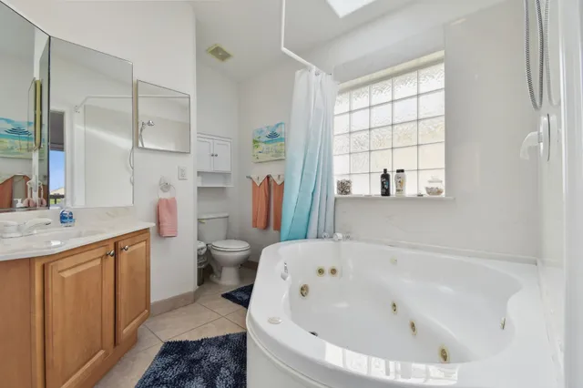 a view of a patio with table and chairs with wooden floor and fence