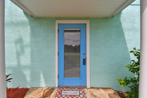 a workspace with furniture and a potted plant