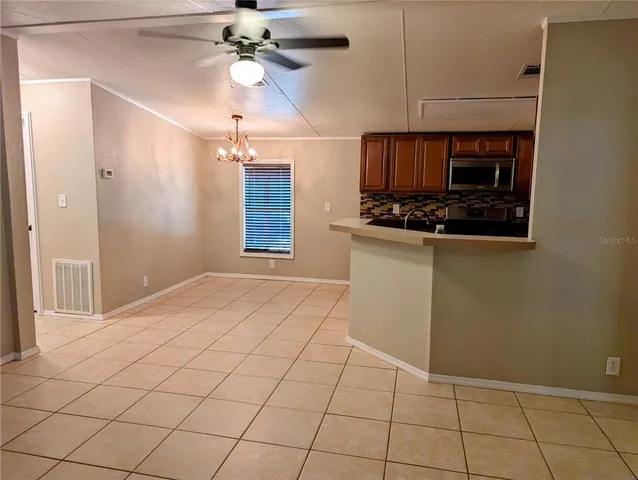 a open kitchen with a sink cabinets and appliances