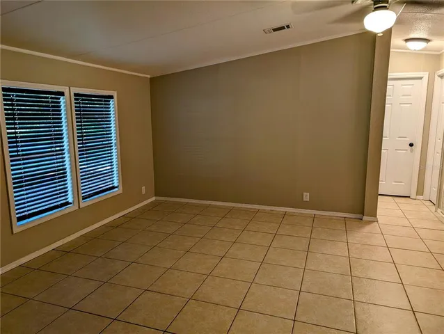 a view of an empty room and window