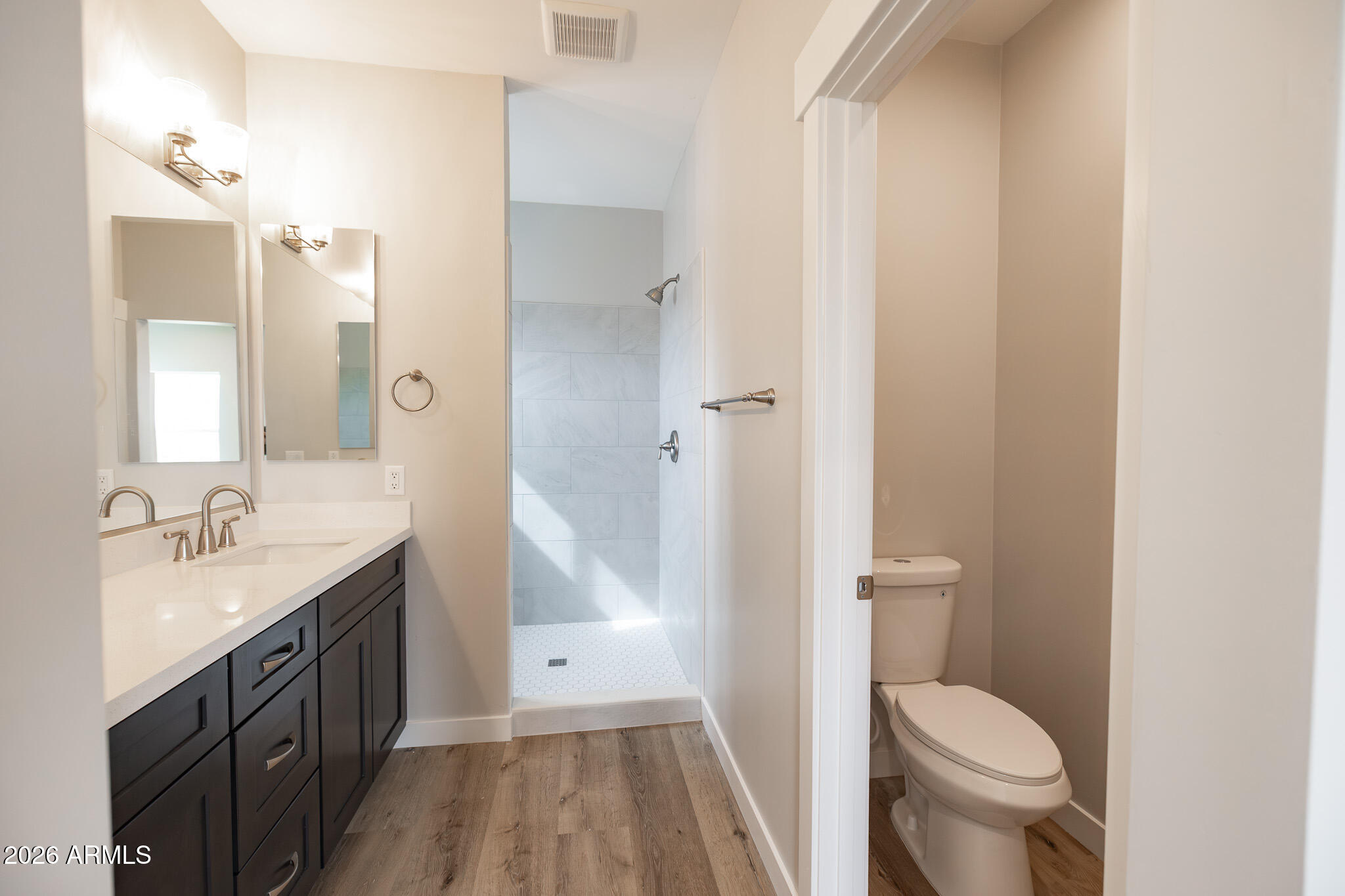 11459 East Adamsville Road Florence, AZ 85132 - Photo 30 of 63 a spacious bathroom with a granite countertop sink toilet and shower
