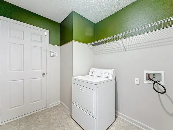 a view of a room that has a bed and a yard