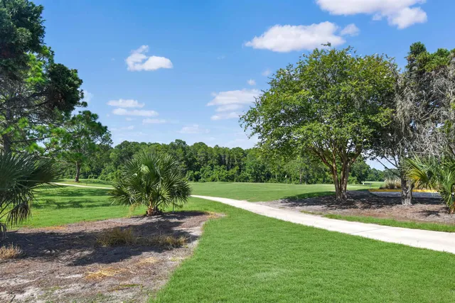 a view of swimming pool with outdoor seating