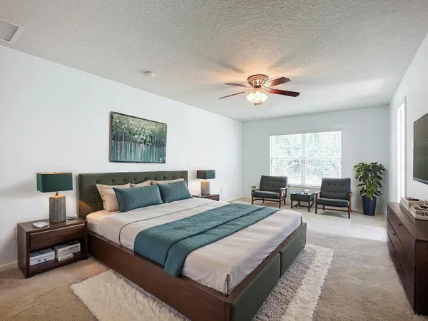 a view of bathroom with a toilet sink mirror and vanity