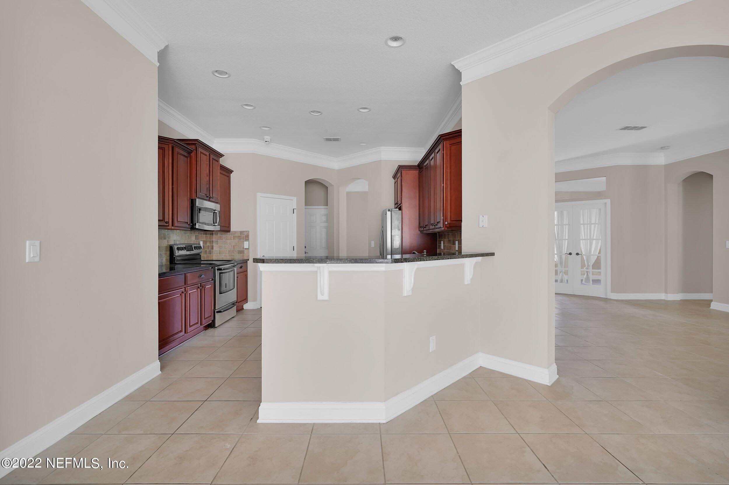 805 Reston Court Jacksonville, FL 32259 - Photo 21 of 44 Living room to kitchen