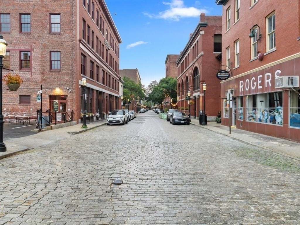 172 Middle Street, Unit 304 Lowell, MA 01852 - Photo 27 of 31 a view of a street with cars