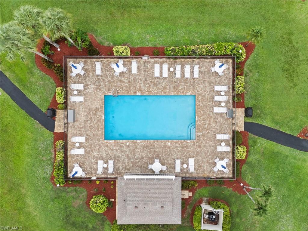 236 Pebble Beach Circle, Unit A202 Naples, FL 34113 - Photo 22 of 25 an aerial view of a house with garden space and street view