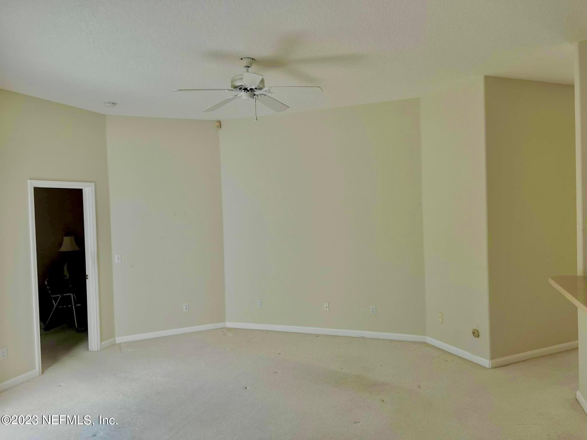 117 Cedar Ridge Circle St. Augustine, FL 32080 - Photo 4 of 27 an empty room with a ceiling fan and closet