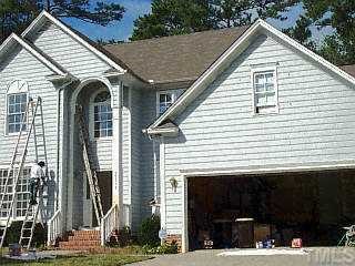 12313 Amoretto Way Raleigh, NC 27613 - Photo 1 of 1 a view of a white house with many windows