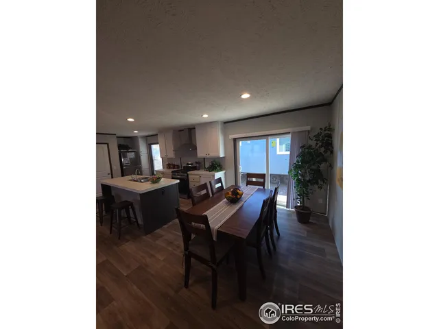 a view of a dining room with furniture and window