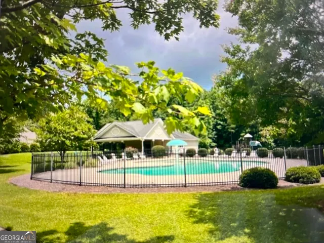 a view of swimming pool with a yard