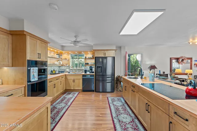 a kitchen with a sink stove and refrigerator