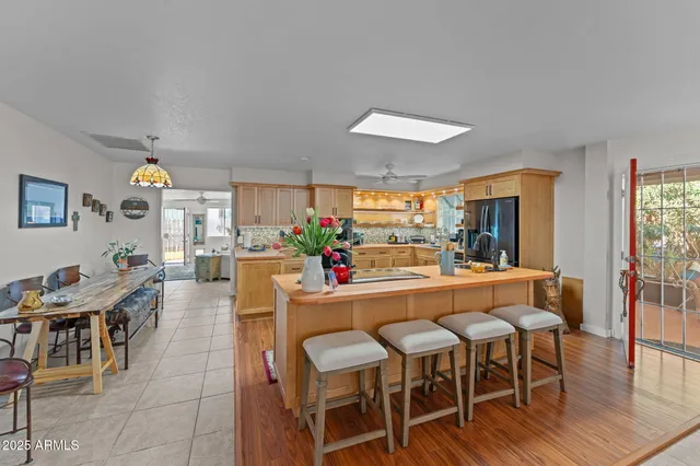 a dining area with furniture and wooden floor