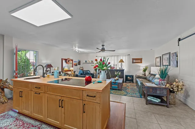 a view of a dining room with furniture and a window