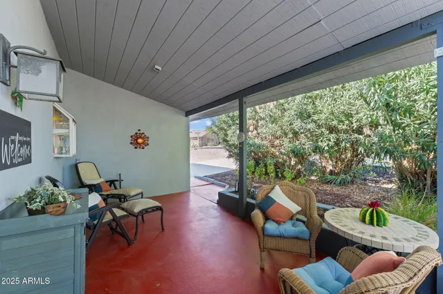 a view of a livingroom with furniture and a potted plant