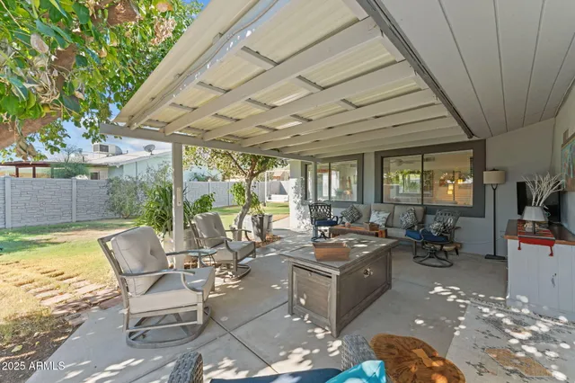 a outdoor space with patio lots of furniture and garden view