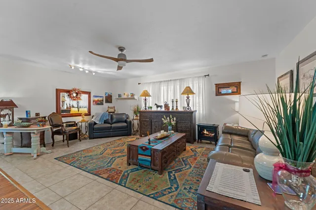 a living room with furniture gym equipment and a flat screen tv