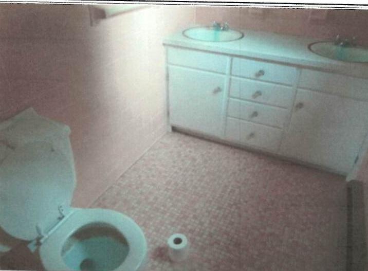 5906 Cove Road Roanoke, VA 24019 - Photo 8 of 8 a bathroom with a sink and toilet