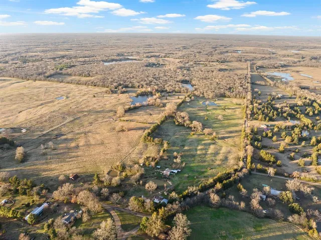 an aerial view of ocean with beach