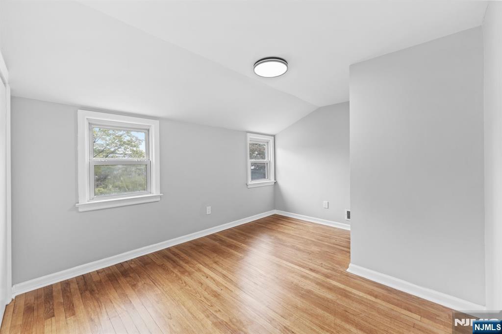 18 Farmingdale Avenue Bloomfield, NJ 07003 - Photo 26 of 50 an empty room with wooden floor and windows