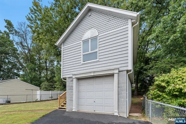 a view of house that has a small yard