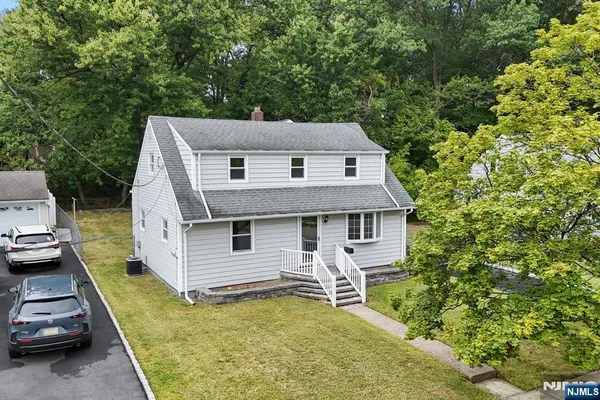 aerial view of a house with a yard