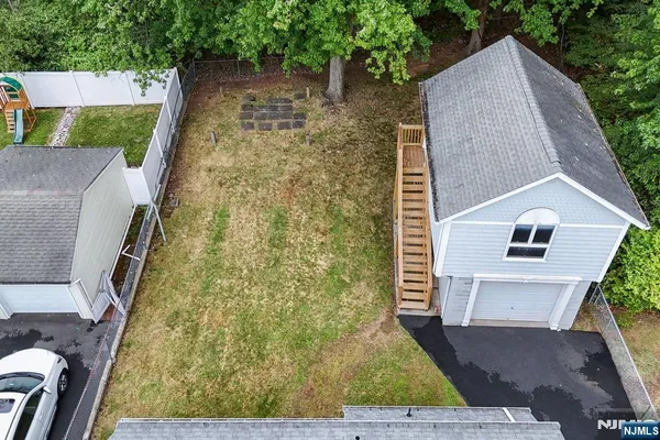 a aerial view of a house with a yard