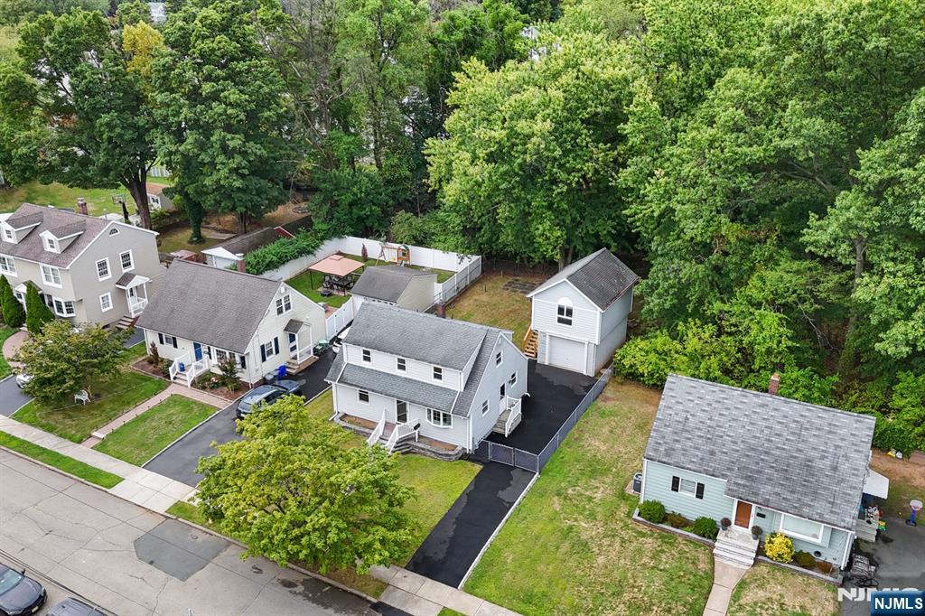 18 Farmingdale Avenue Bloomfield, NJ 07003 - Photo 44 of 50 an aerial view of a house with garden space and street view