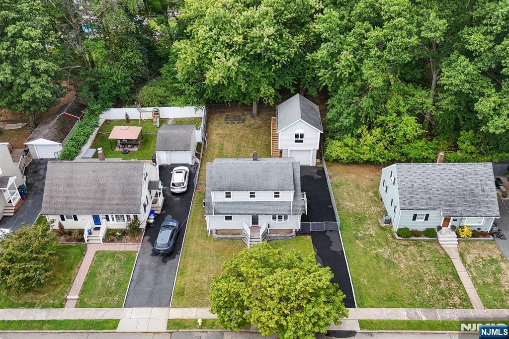 18 Farmingdale Avenue Bloomfield, NJ 07003 - Photo 45 of 50 an aerial view of a house with swimming pool garden and patio