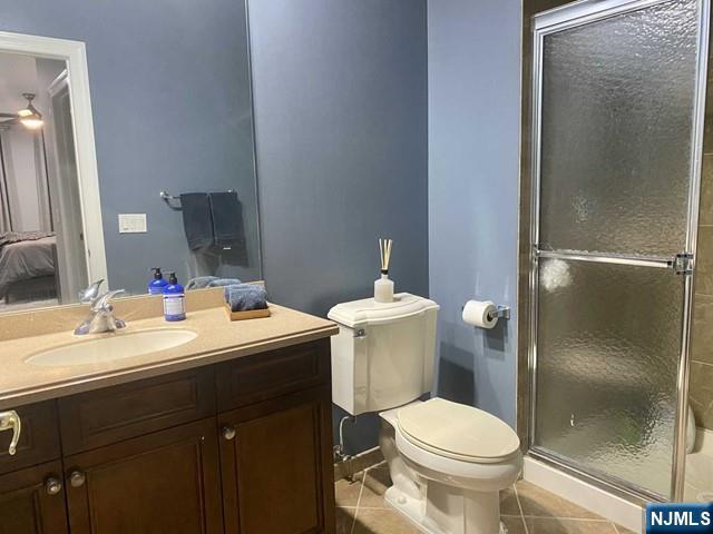 54 Polifly Road, Unit 104 Hackensack, NJ 07601 - Photo 10 of 11 a bathroom with a sink toilet and shower