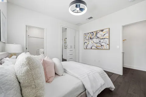 a bedroom with bed and a window