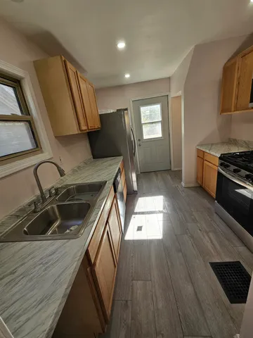 a kitchen that has a sink and a stove