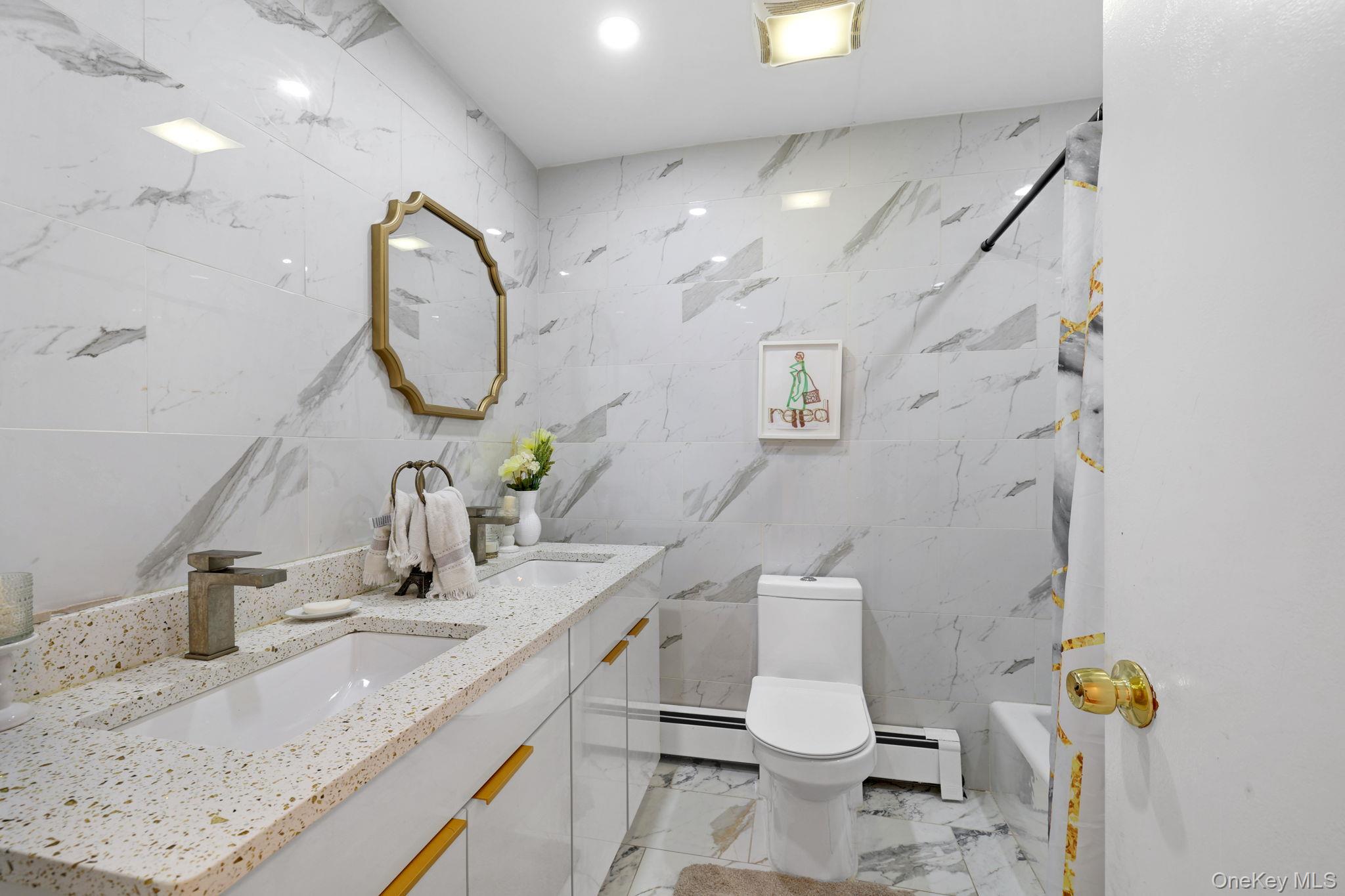35 Kroeger Road Monticello, NY 12701 - Photo 10 of 29 a bathroom with a granite countertop toilet sink and mirror