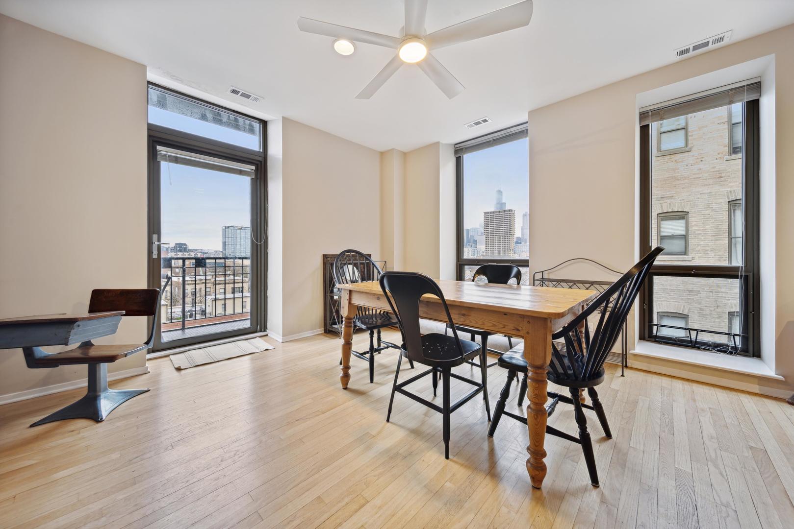 811 South Lytle Street, Unit 510 Chicago, IL 60607 - Photo 12 of 26 a view of a dining room with furniture and wooden floor
