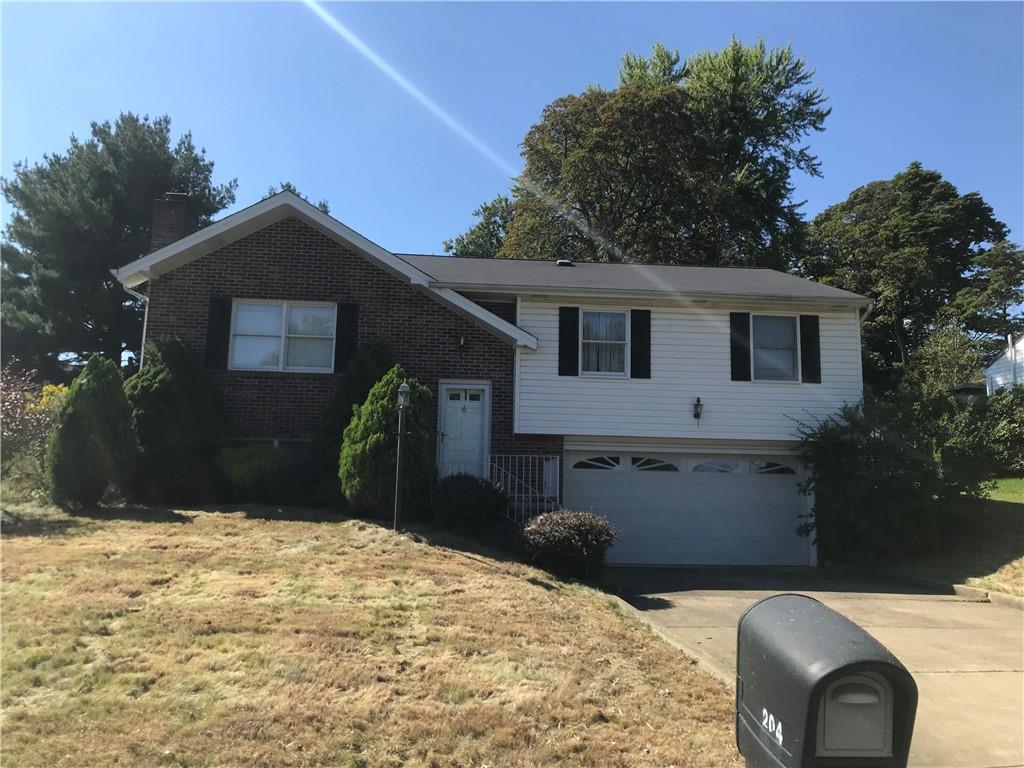 204 Fairview Drive Irwin, PA 15642 - Photo 2 of 12 a front view of a house with a yard