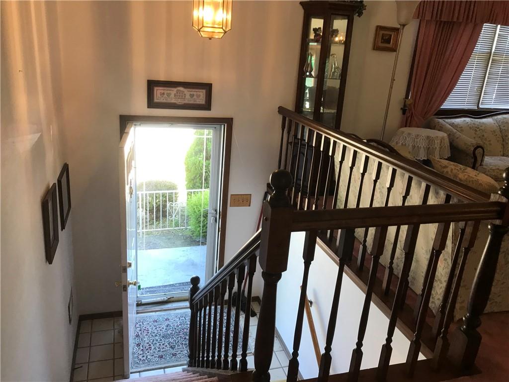 204 Fairview Drive Irwin, PA 15642 - Photo 4 of 12 a view of staircase with lots of frames on wall and a window