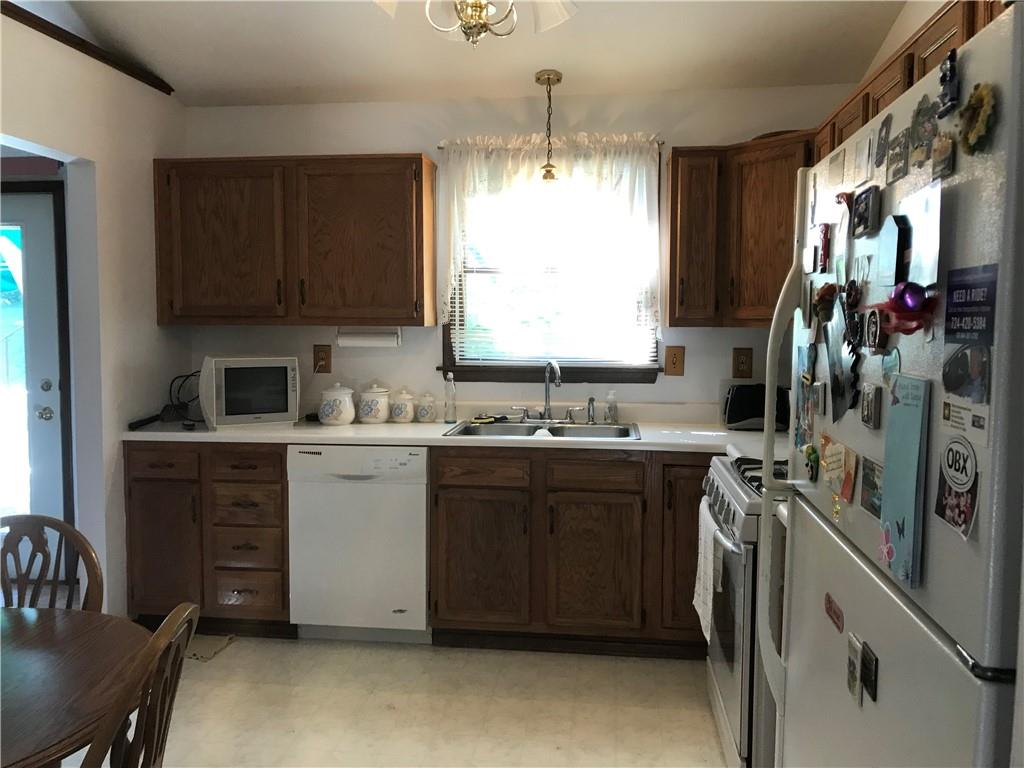 204 Fairview Drive Irwin, PA 15642 - Photo 7 of 12 a kitchen with a sink stove and cabinets