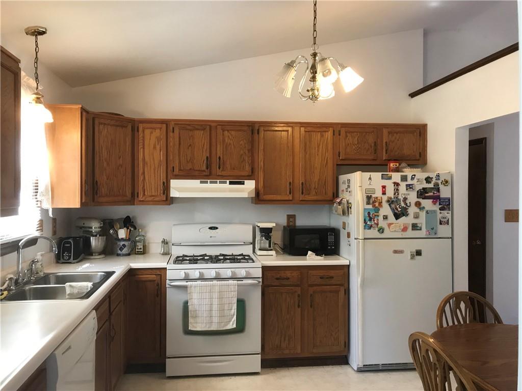 204 Fairview Drive Irwin, PA 15642 - Photo 8 of 12 a kitchen with refrigerator cabinets and a sink