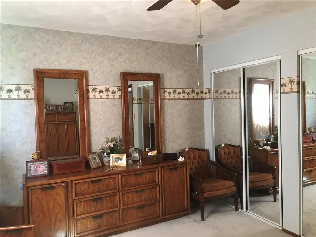 204 Fairview Drive Irwin, PA 15642 - Photo 9 of 12 a bathroom with a double vanity sink and a mirror