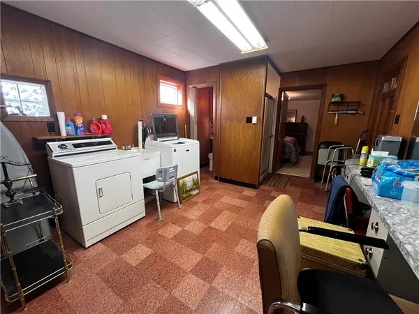 a view of kitchen with furniture and windows