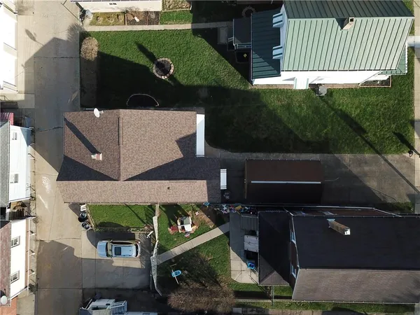 an aerial view of houses with yard