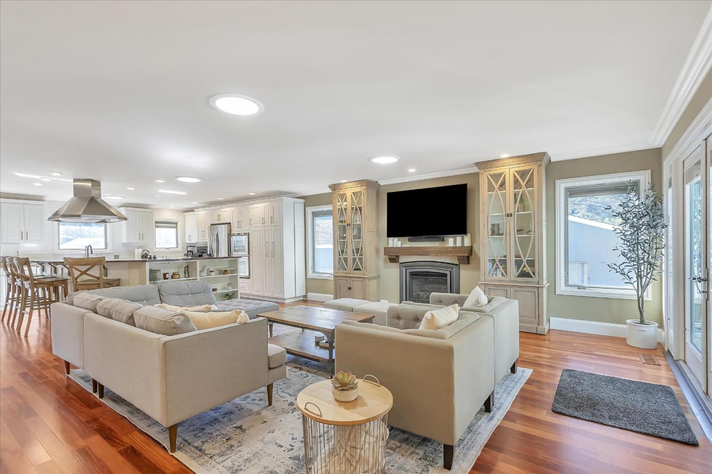 1261 Oddstad Boulevard Pacifica, CA 94044 - Photo 16 of 62 a living room with furniture a flat screen tv and a fireplace