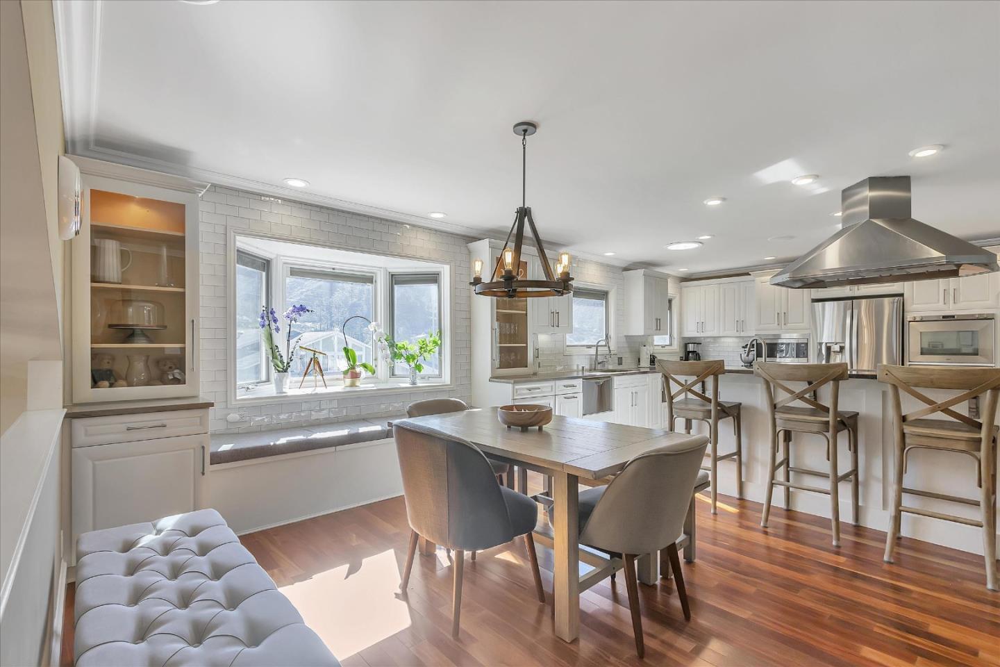 1261 Oddstad Boulevard Pacifica, CA 94044 - Photo 20 of 62 a dining table with chairs and wooden floor