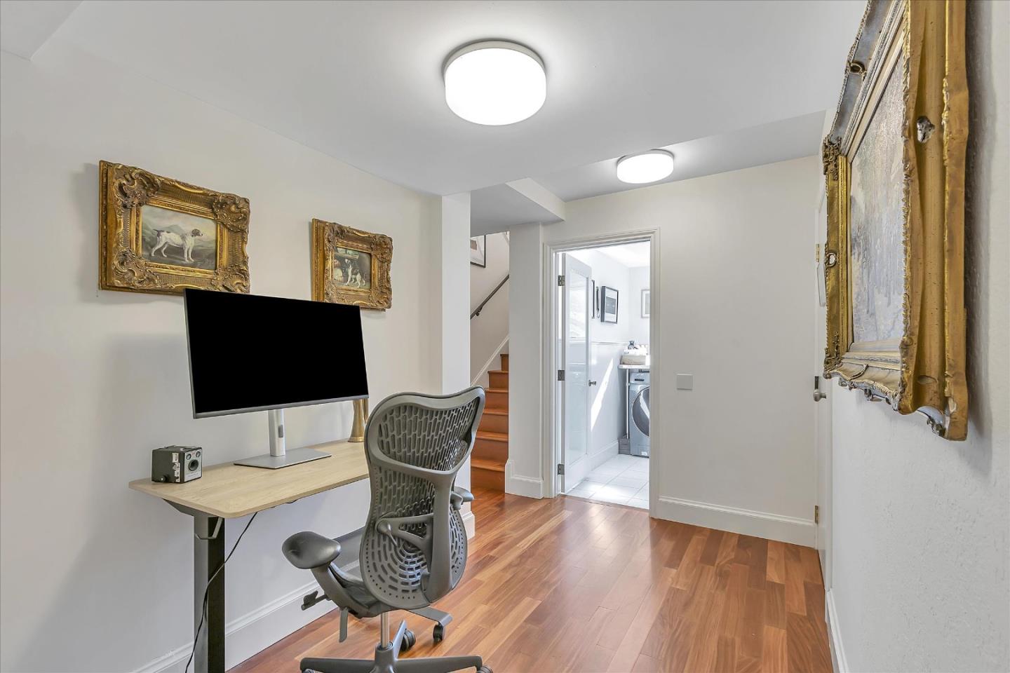 1261 Oddstad Boulevard Pacifica, CA 94044 - Photo 22 of 62 a view of a workspace with furniture and a flat screen tv