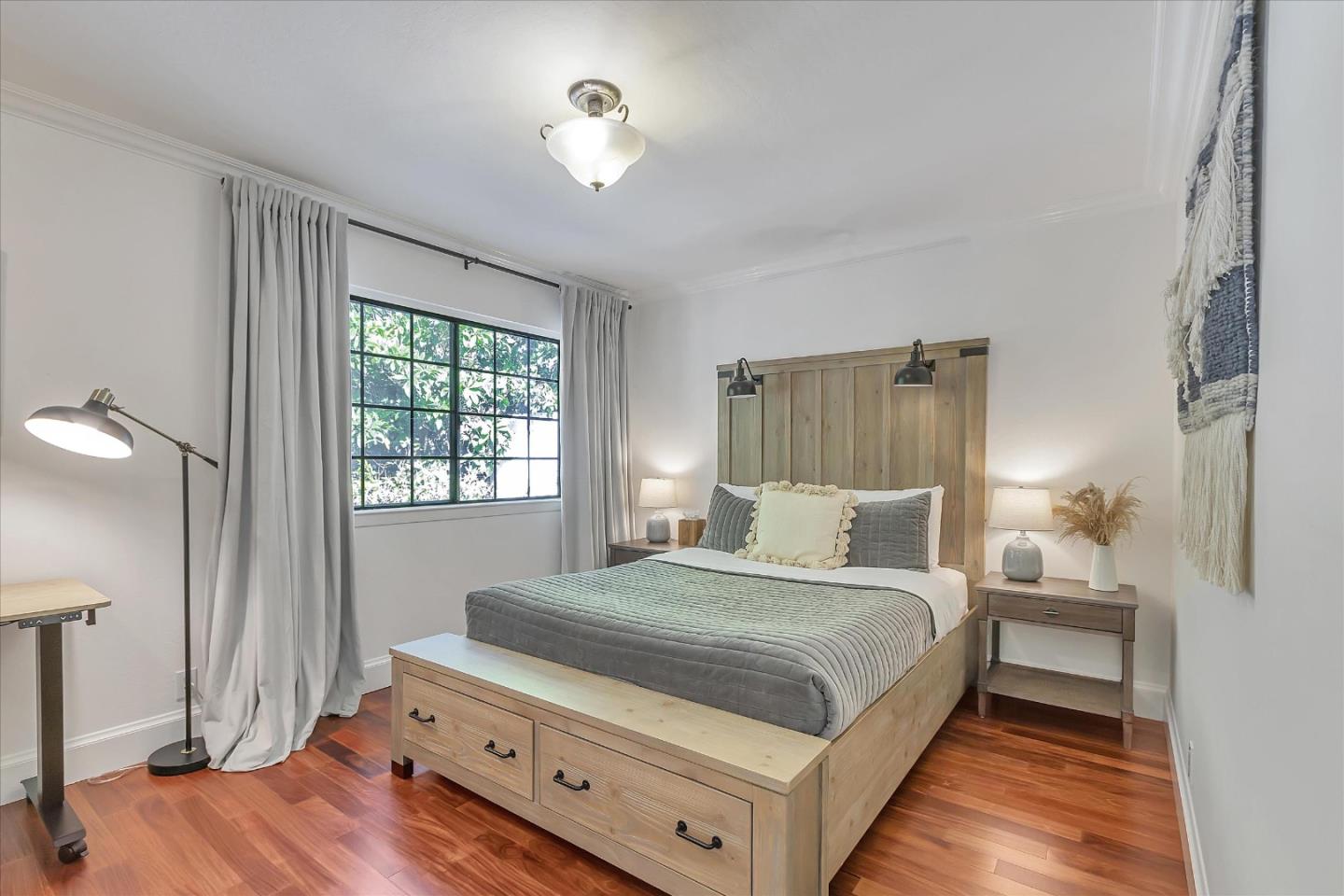 1261 Oddstad Boulevard Pacifica, CA 94044 - Photo 27 of 62 a bedroom with a bed and a night stand