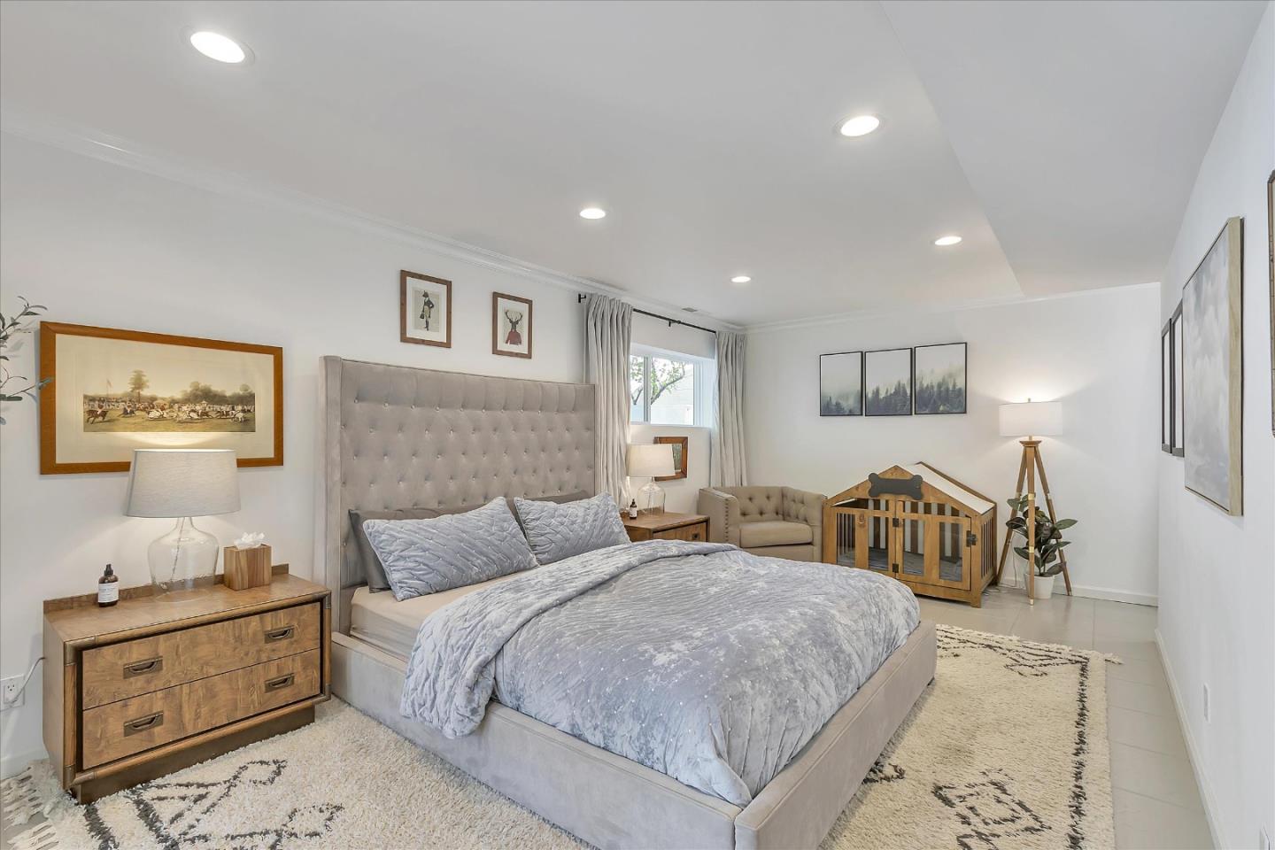 1261 Oddstad Boulevard Pacifica, CA 94044 - Photo 34 of 62 a spacious bedroom with a large bed and a couch