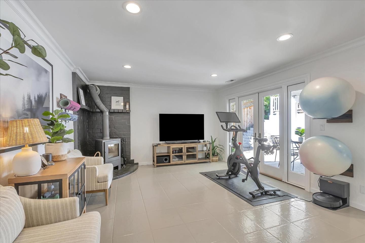 1261 Oddstad Boulevard Pacifica, CA 94044 - Photo 38 of 62 a living room with furniture a window and a flat screen tv