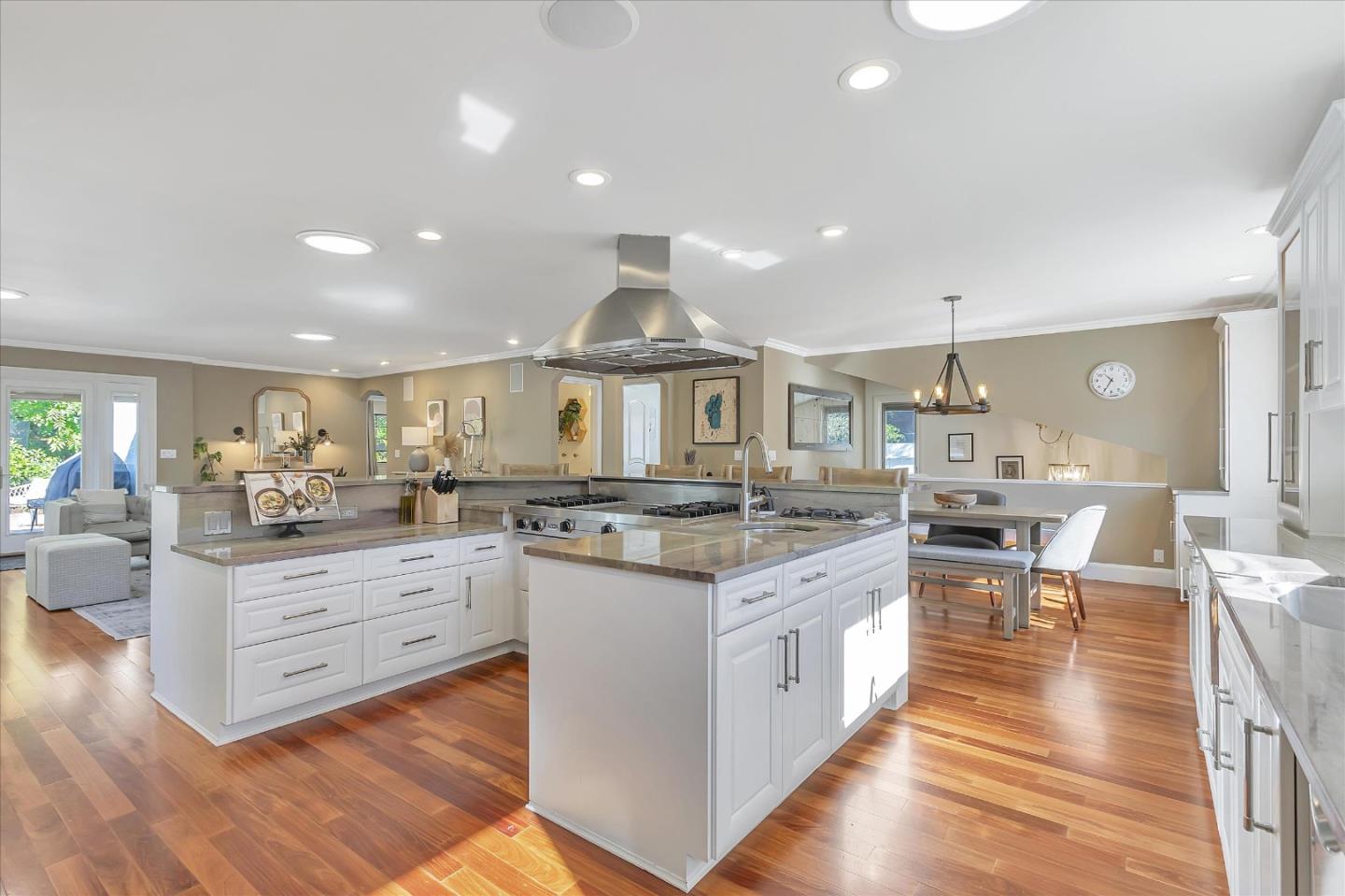 1261 Oddstad Boulevard Pacifica, CA 94044 - Photo 4 of 62 a kitchen with stainless steel appliances granite countertop a stove and a wooden floors