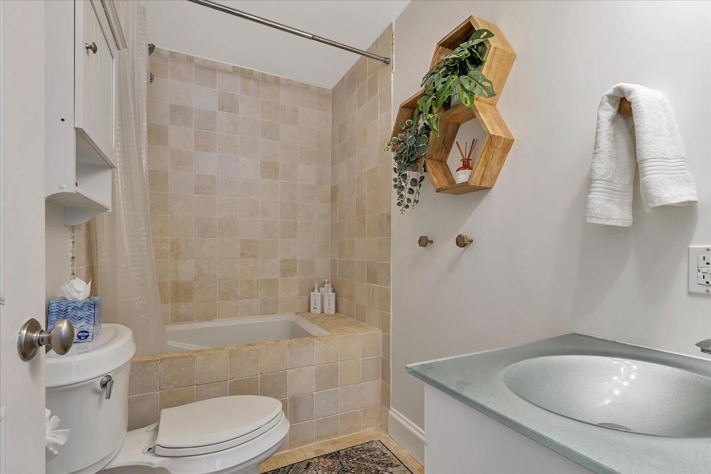 1261 Oddstad Boulevard Pacifica, CA 94044 - Photo 42 of 62 a bathroom with a sink a toilet and shower